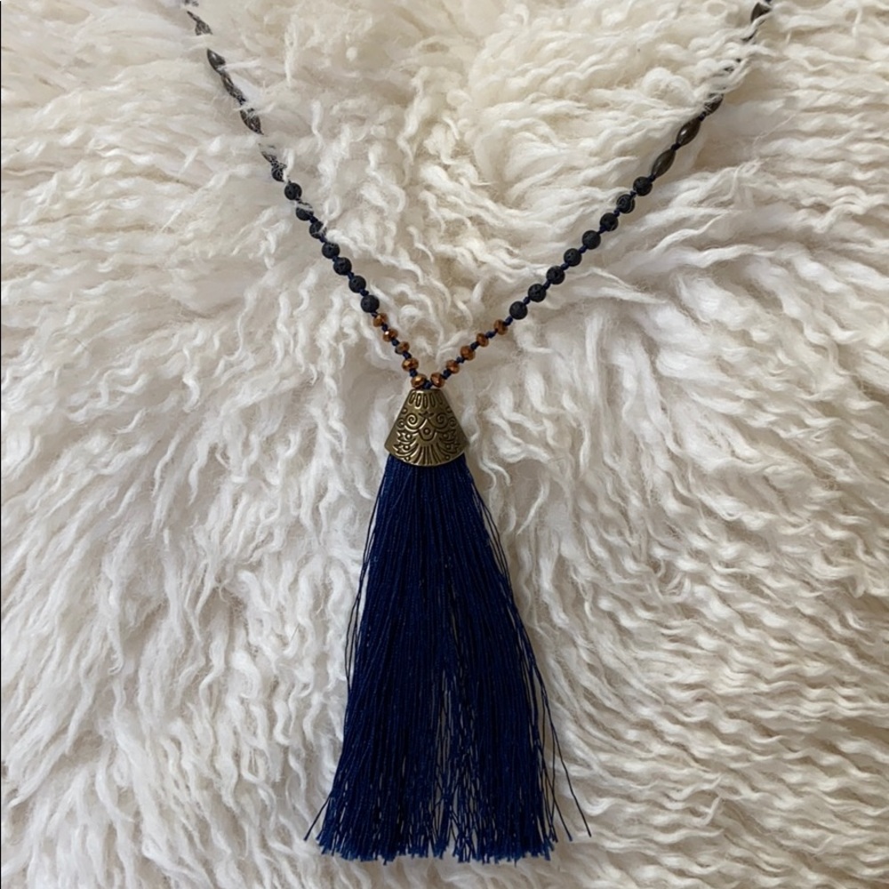 Threaded strands and beaded necklace